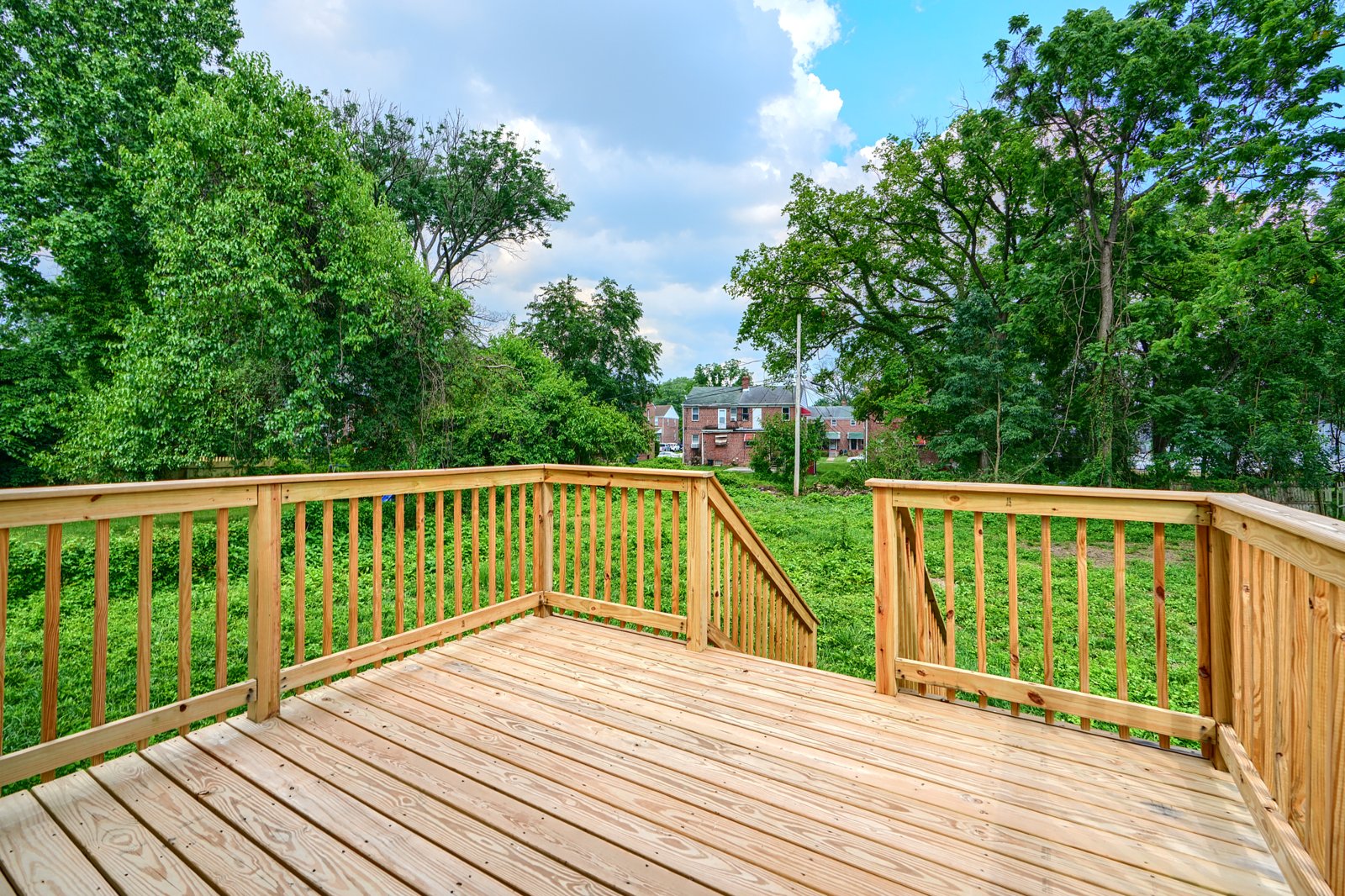 Custom wood deck overlooking the backyard
